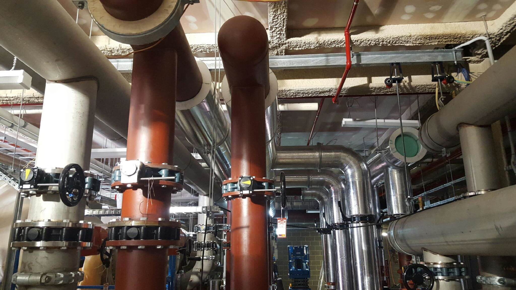 An image of pipe insulation used in Perth, typically made of foam material that wraps around pipes. The insulation comes in various sizes and thicknesses to fit different pipe diameters and provide thermal and acoustic insulation.