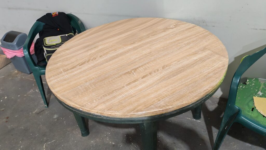Round tabletop with a wood-look surface finish